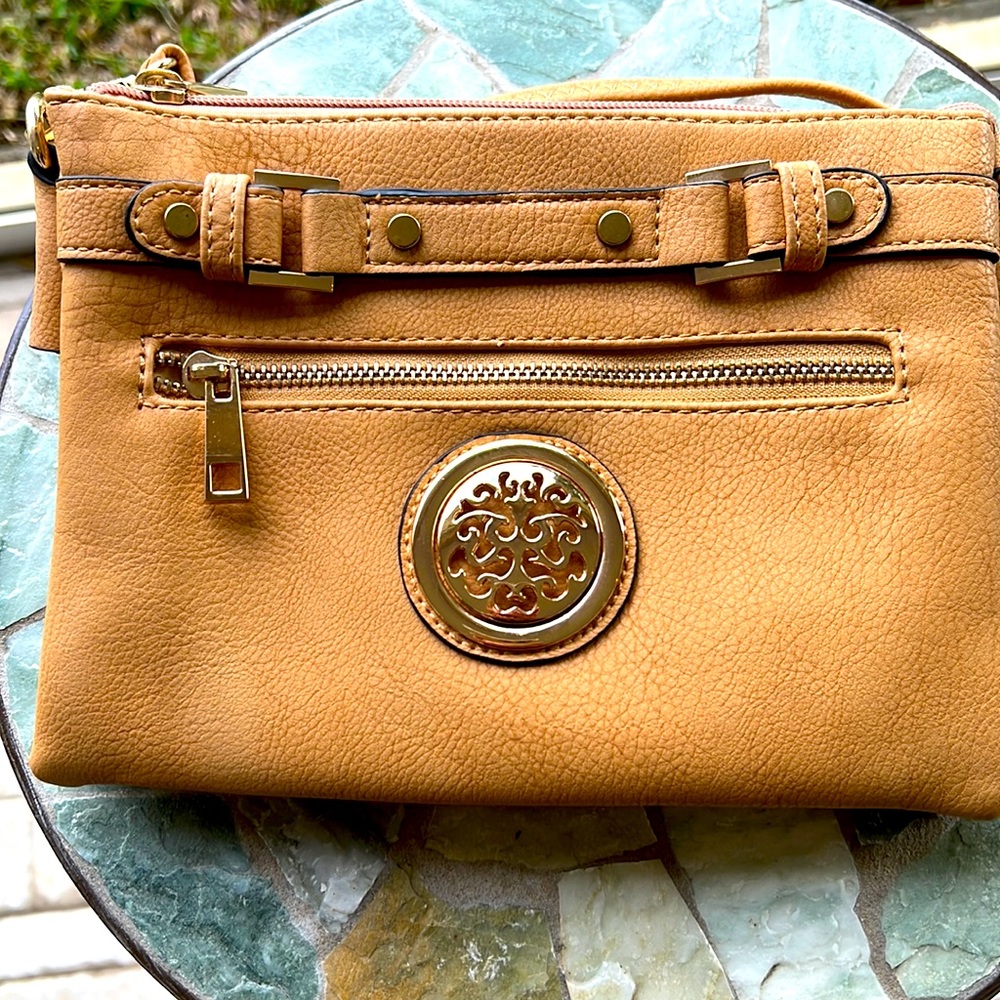 Like new used mustard color cross bag or shoulder. Size   9x6.5x2.5.